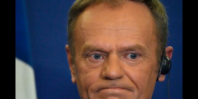 Donald Tusk holds a press conference in Versailles, France on March 10, 2022.