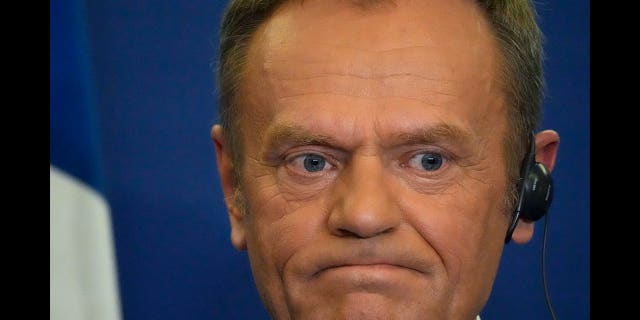 Donald Tusk holds a press conference in Versailles, France on March 10, 2022.