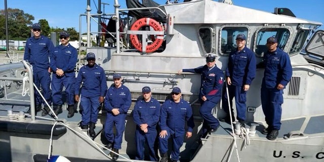 TJ Foley and his friend Drew Vukov are pictured with other U.S. Coast Guard Reserve members in this image.