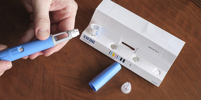 Man prepares the Semaglutide Ozempic injection, which is intended to control blood sugar levels.