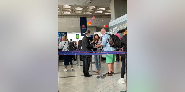 One of the many helpful overseas gate agents that help us board easily with a child.