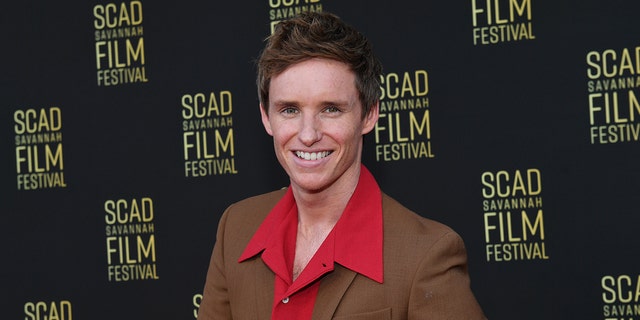 Eddie Redmayne recalled the moment he met Taylor Swift and said it was "hilarious."
