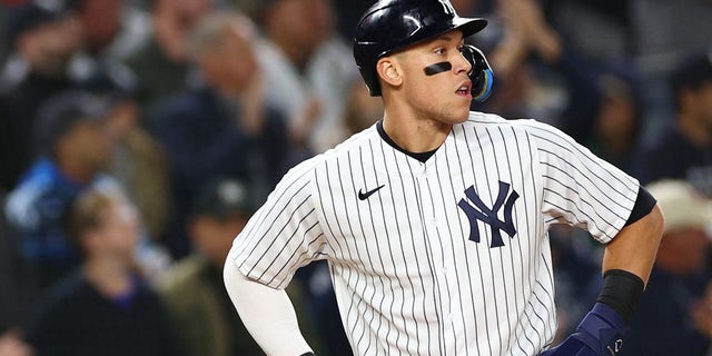 Aaron Judge, #99 of the New York Yankees, looks on after reaching third base in the second inning against the Houston Astros in game four of the American League Championship Series at Yankee Stadium on Oct. 23, 2022 in the Bronx borough of New York City.