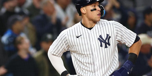 Aaron Judge, #99 of the New York Yankees, looks on after reaching third base in the second inning against the Houston Astros in game four of the American League Championship Series at Yankee Stadium on Oct. 23, 2022 in the Bronx borough of New York City.