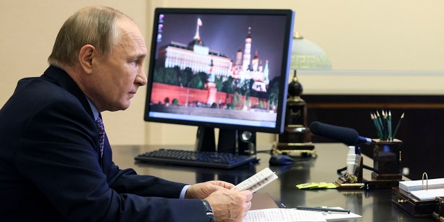 Russian President Vladimir Putin attends a meeting on economic issues via videoconference at the Novo-Ogaryovo residence outside Moscow, Russia, Thursday, Oct. 6, 2022. 