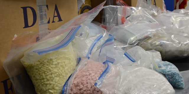 The brightly colored fentanyl pills were sorted by color in large Ziploc bags. 