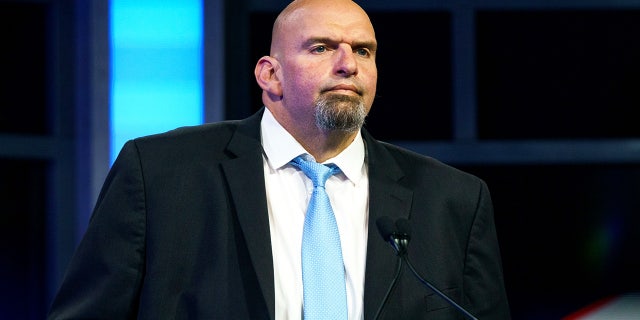 Pennsylvania Democratic Senator John Fetterman participates in a debate with Republican challenger Dr. Mehmet Oz in Harrisburg, Pennsylvania, Oct. 25.