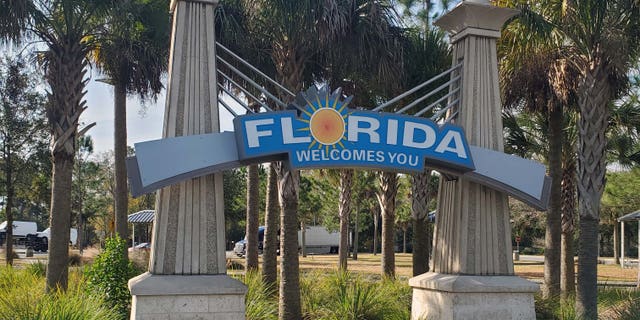 Travelers are greeted by a Florida Welcome Sign display at the I-75 Welcome Center complex in Jennings, Fla.