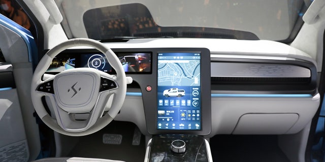 A large tablet-style touchscreen serves the infotainment system.