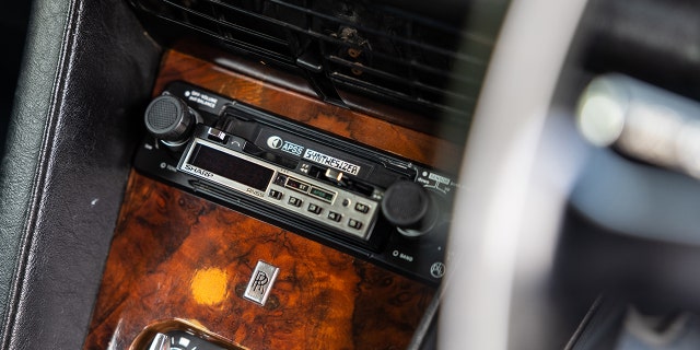 The car is equipped with a Sharp cassette player.