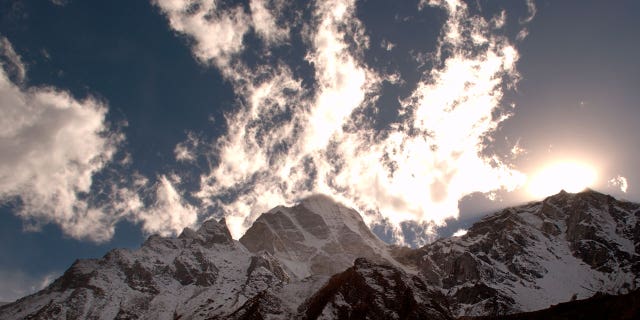 A sunrise is seen above the mountains on the way to Gaumukh from Gangotri, Garhwal Himalayas, Uttarakhand, India. 
