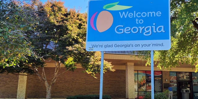 A sign welcomes travelers to the Peach State at the I-20 East Welcome Center near Tallapoosa, Ga. on October 3, 2022.