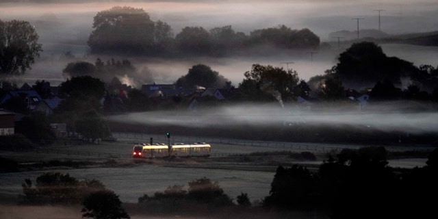 Germany's planned global public transport ticket would cost riders $47 per month, as either a one-time purchase or monthly rolling purchase. Pictured: A regional train travels through Frankfurt, Germany, on Oct. 7, 2022.