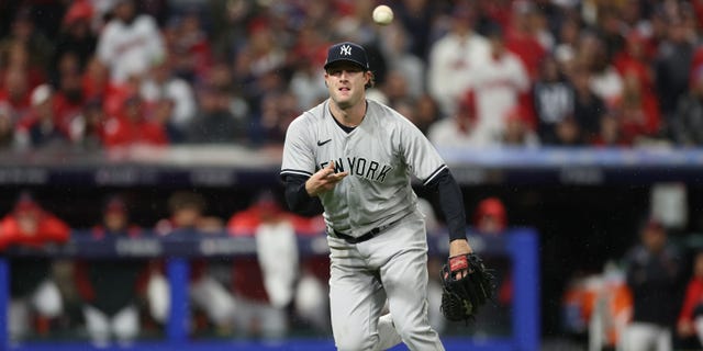 Gerrit Cole #45 of the New York Yankees throws the ball to first base against the Cleveland Guardians during the fifth inning in game four of the American League Division Series at Progressive Field on October 16, 2022 in Cleveland, Ohio.