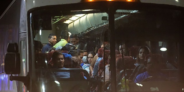 Migrants arrive at the Port Authority bus terminal in New York on Sept. 27, 2022. 