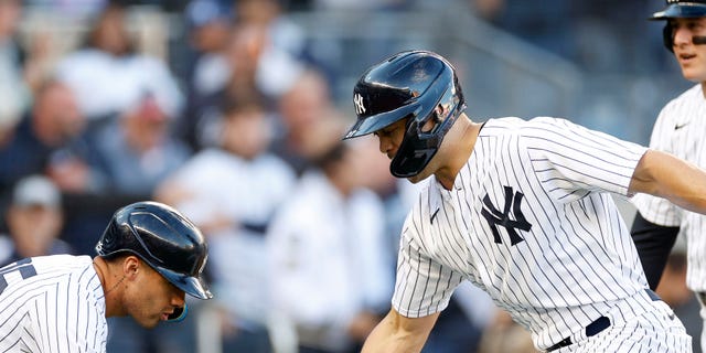 Giancarlo Stanton, right, of the New York Yankees celebrates his three-run home run with Gleyber Torres and Anthony Rizzo during the first inning against the Cleveland Guardians in Game 5 of an American League Division Series at Yankee Stadium Oct. 18, 2022, in New York.