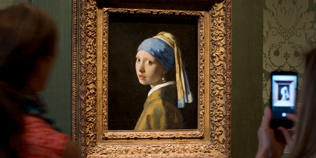 Vermeer's masterpiece "The girl with the Pearl Earring" it is protected by glass and has not been damaged, the museum said.