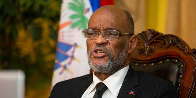 Prime Minister Ariel Henry and 18 other top-ranking officials requested the immediate deployment of foreign armed troops to prevent gangs and protestors from crippling the nation. Pictured: Haiti's Prime Minister Ariel Henry speaking with the Associated Press in Port-au-Prince, Haiti, on Sept. 28, 2021.