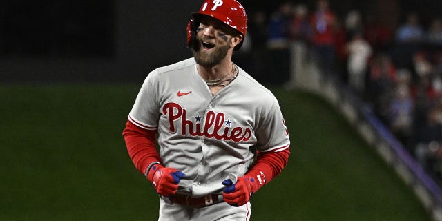 Bryce Harper #3 of the Philadelphia Phillies celebrates after hitting a solo home run against the St. Louis Cardinals during the second inning in game two of the National League Wild Card Series at Busch Stadium on October 08, 2022 in St. Louis, Missouri.