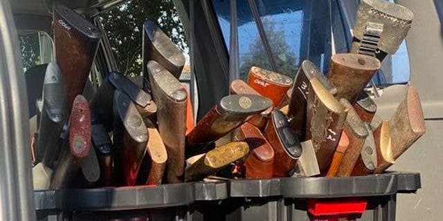 Dozens of shotguns and rifles sit in bins in the back of a car following Houston's gun buyback event.