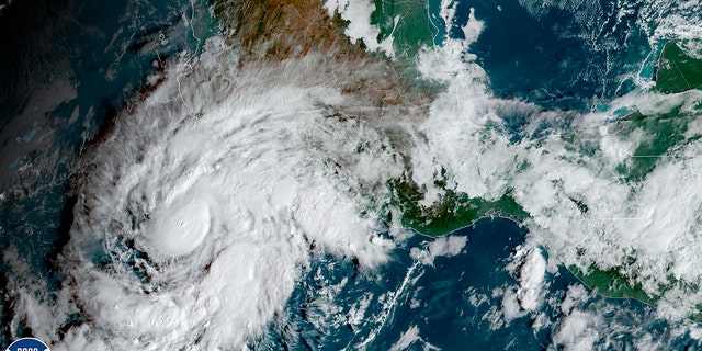 This satellite image taken at 10am ET and provided by NOAA shows Tropical Storm Roslyn approaching the Pacific coast of Mexico, Friday, Oct. 21, 2022. 