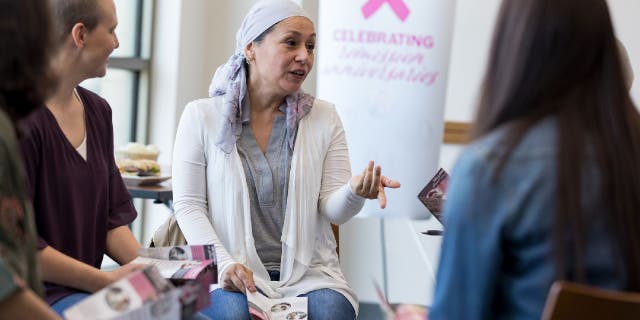 Women talk during breast cancer meeting