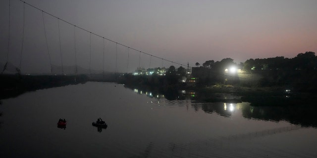 A century-old cable suspension bridge collapsed into the river Sunday evening, sending hundreds plunging in the water in one of the country's worst accidents in years.