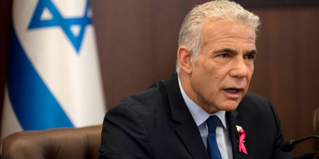 FILE - Israeli Prime Minister Yair Lapid makes an opening statement as he chairs the weekly cabinet meeting in Jerusalem, Oct. 2, 2022. Israel’s prime minister said Tuesday, Oct. 11,  that the country has reached an "historic agreement" with neighboring Lebanon over their shared maritime border after months of U.S.-brokered negotiations.(AP Photo/Maya Alleruzzo, File)