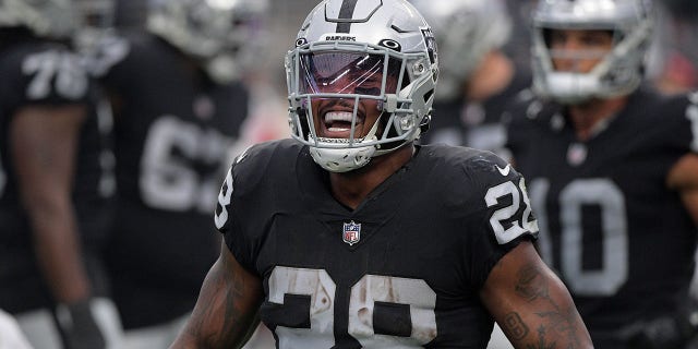 Josh Jacobs #28 of the Las Vegas Raiders celebrates a touchdown in the fourth quarter against the Houston Texans at Allegiant Stadium on October 23, 2022 in Las Vegas, Nevada.