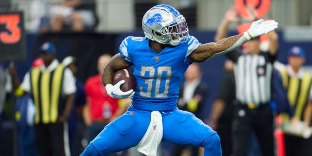 Jamaal Williams #30 of the Detroit Lions reacts after a play against the Dallas Cowboys during the first half of the game at AT&T Stadium on October 23, 2022 in Arlington, Texas.