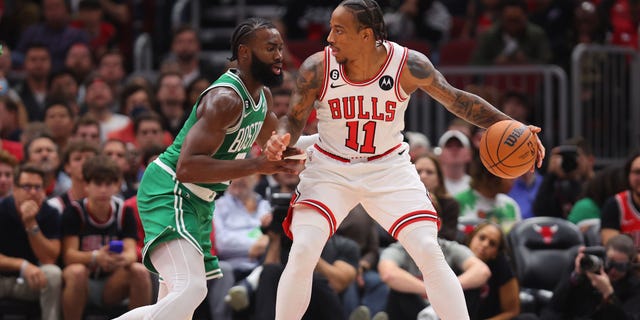 DeMar DeRozan #11 of the Chicago Bulls dribbles against Jaylen Brown #7 of the Boston Celtics during the first half at United Center on October 24, 2022 in Chicago, Illinois.