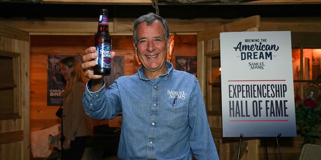 Boston Beer Co. founder Jim Koch raises a beer at the Samuel Adams Crafting Dreams Beer Bash in New York City on Sept. 7, 2022.
