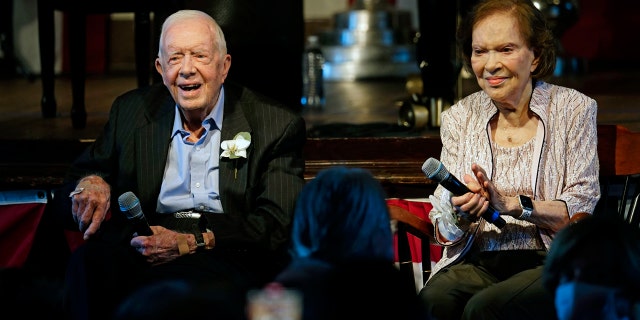 Former President Jimmy Carter and his wife former first lady Rosalynn Carter sit together during a reception to celebrate their 75th wedding anniversary July 10, 2021, in Plains, Georgia.