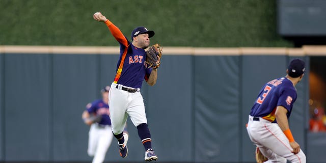 Jose Altuve of the Houston Astros throws out Julio Rodriguez of the Seattle Mariners during the third inning of Game 2 of an American League Division Series at Minute Maid Park Oct. 13, 2022, in Houston.