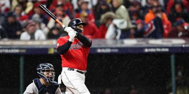 Josh Naylor of the Cleveland Guardians hits a home run against the New York Yankees during the fourth inning in Game 4 of the American League Division Series at Progressive Field on Oct. 16, 2022, in Cleveland.