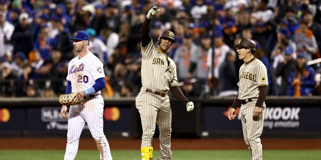 Juan Soto #22 of the San Diego Padres celebrates after hitting a 2 run RBI single against the New York Mets during the eighth inning in game three of the National League Wild Card Series at Citi Field on October 09, 2022 in the Flushing neighborhood of the Queens borough of New York City.