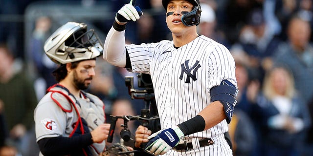 Aaron Judge of the New York Yankees reacts after hitting a home run against the Cleveland Guardians during the second inning in Game 5 of an American League Division Series at Yankee Stadium Oct. 18, 2022, in New York.