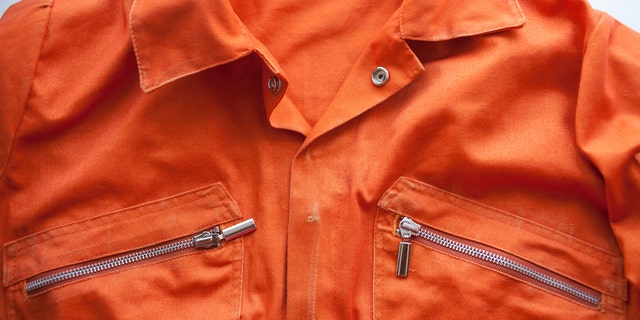 An orange jumpsuit of a prisoner.