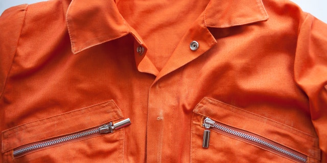 An orange jumpsuit of a prisoner.