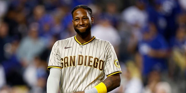 Jurickson Profar #10 of the San Diego Padres reacts after pitching in the third inning in game one of the National League Division Series against the Los Angeles Dodgers at Dodger Stadium on October 11, 2022 in Los Angeles, California.