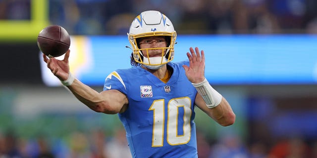 Justin Herbert #10 of the Los Angeles Chargers looks to pass during the second quarter against the Denver Broncos at SoFi Stadium on October 17, 2022 in Inglewood, California.