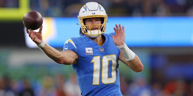 Justin Herbert #10 of the Los Angeles Chargers looks to pass during the second quarter against the Denver Broncos at SoFi Stadium on October 17, 2022 in Inglewood, California.