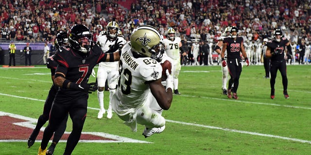 Juwan Johnson #83 of the New Orleans Saints catches a touchdown in the fourth quarter of a game against the Arizona Cardinals at State Farm Stadium in Glendale, Arizona on October 20, 2022.