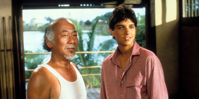 Pat Morita and Ralph Macchio in a scene from the film 'The Karate Kid', 1984.