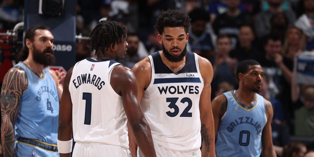 Anthony Edwards #1 and Karl-Anthony Towns #32 of the Minnesota Timberwolves speak during Game 4 of Round 1 of the 2022 NBA Playoffs on April 23, 2022 at Target Center in Minneapolis, Minnesota.