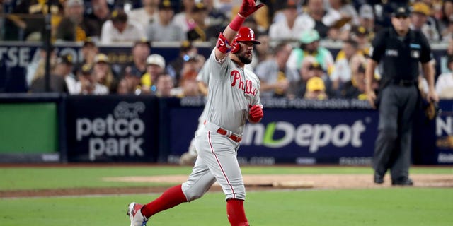 Kyle Schwarber #12 of the Philadelphia Phillies reacts after hitting a home run during the sixth inning against the San Diego Padres in game one of the National League Championship Series at PETCO Park on October 18, 2022 in San Diego, California.