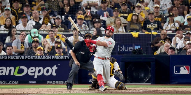 Kyle Schwarber #12 of the Philadelphia Phillies hits a home run during the sixth inning against the San Diego Padres in game one of the National League Championship Series at PETCO Park on October 18, 2022 in San Diego, California.
