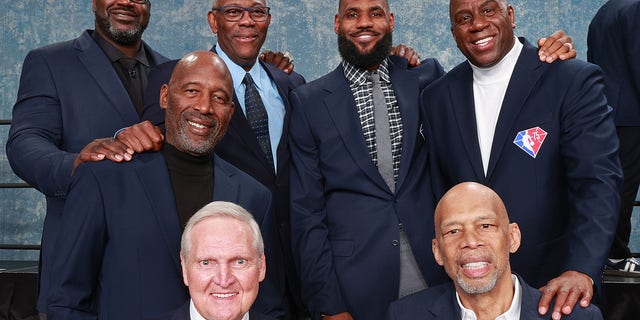 NBA legends Shaquille O'Neal, Bob McAdoo, LeBron James, Magic Johnson, James Worthy, Jerry West and Kareem Abdul-Jabbar pose for a photo during NBA All-Star Weekend on Feb. 19, 2022, at Rocket Mortgage FieldHouse in Cleveland.