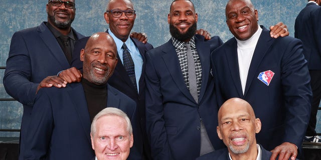 NBA legends Shaquille O'Neal, Bob McAdoo, LeBron James, Magic Johnson, James Worthy, Jerry West and Kareem Abdul-Jabbar pose for a photo during NBA All-Star Weekend on Feb. 19, 2022, at Rocket Mortgage FieldHouse in Cleveland.