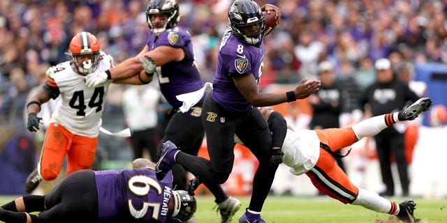Lamar Jackson #8 of the Baltimore Ravens avoids being tackled during the second half of the game against the Cleveland Browns at M&T Bank Stadium on October 23, 2022, in Baltimore, Maryland.